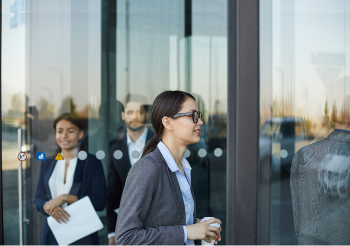 Business people going through doors.png