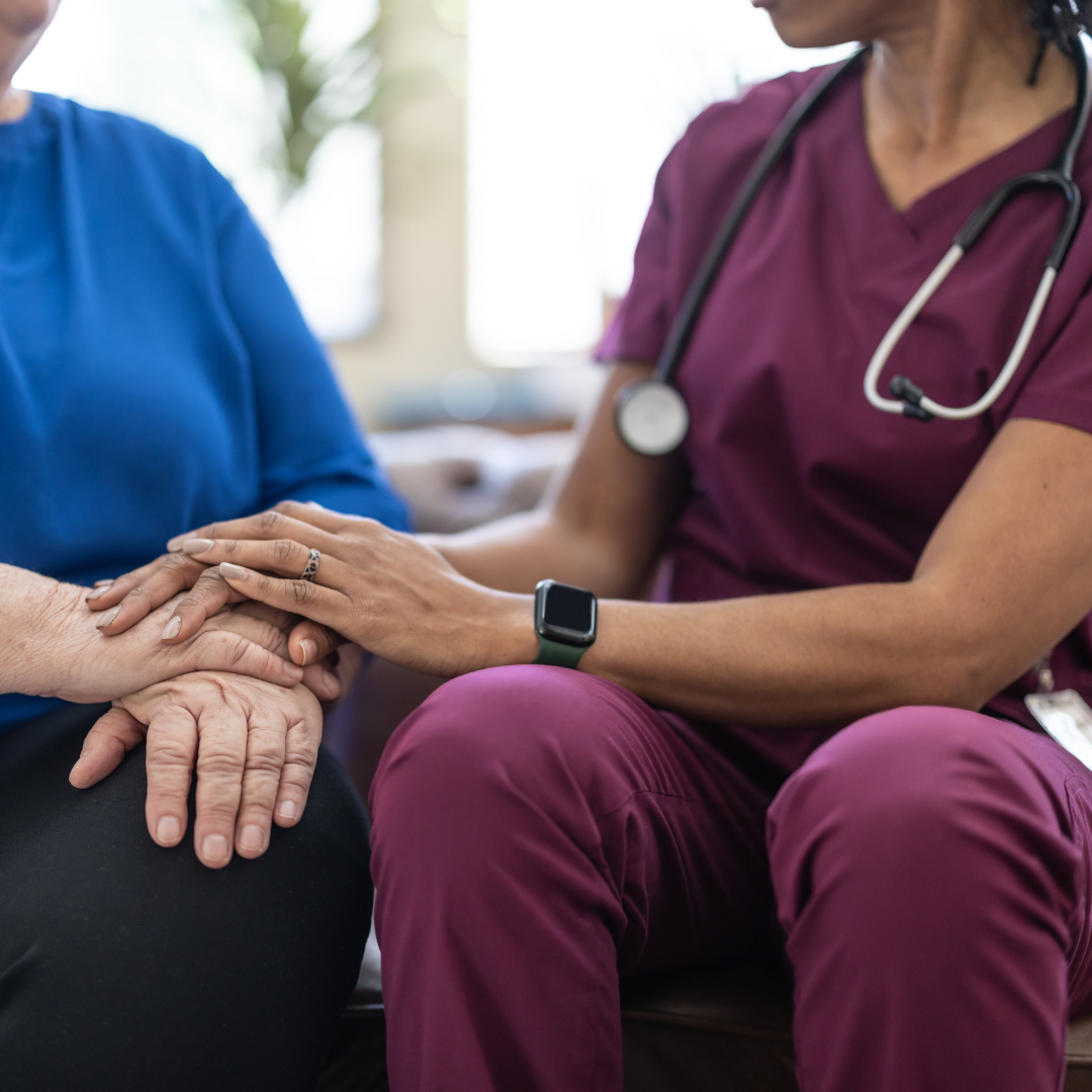 A doctor and a patient holding hands